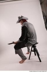 JACK PIRATE SITTING POSE WITH GUN AND DAGGER